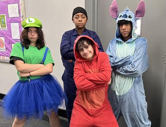 Students in Halloween costumes including Luigi and Stitch