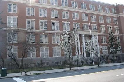 Exterior view of a large red brick school building