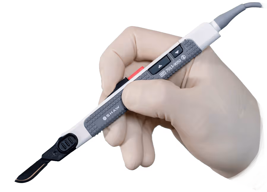 A gloved hand holds an electric surgical device, ready for use in a medical procedure.