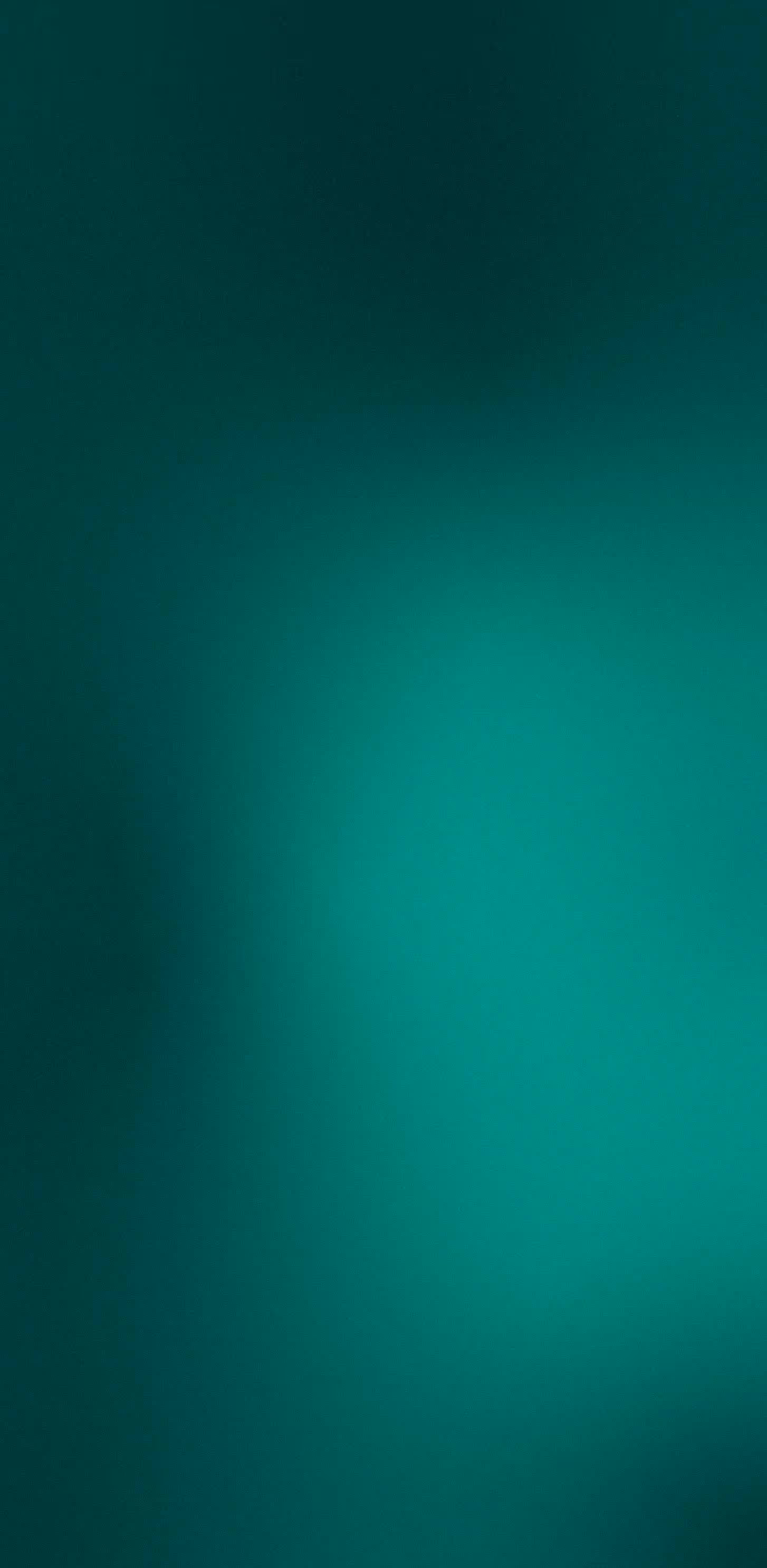 Blurred gradient background with shades of teal and green.