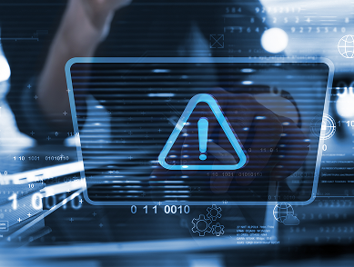 Transparent digital warning icon with exclamation mark over a blurred person using a keyboard with floating numbers and data graphics.