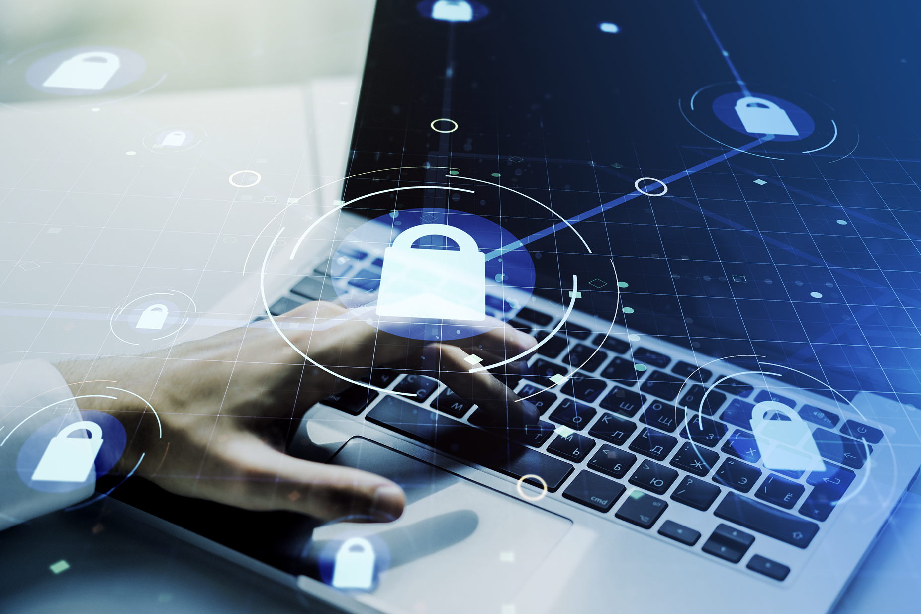 Hand typing on a laptop keyboard with digital padlock icons symbolizing cybersecurity and data protection.