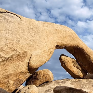 A large rock with a hand carved out of it.