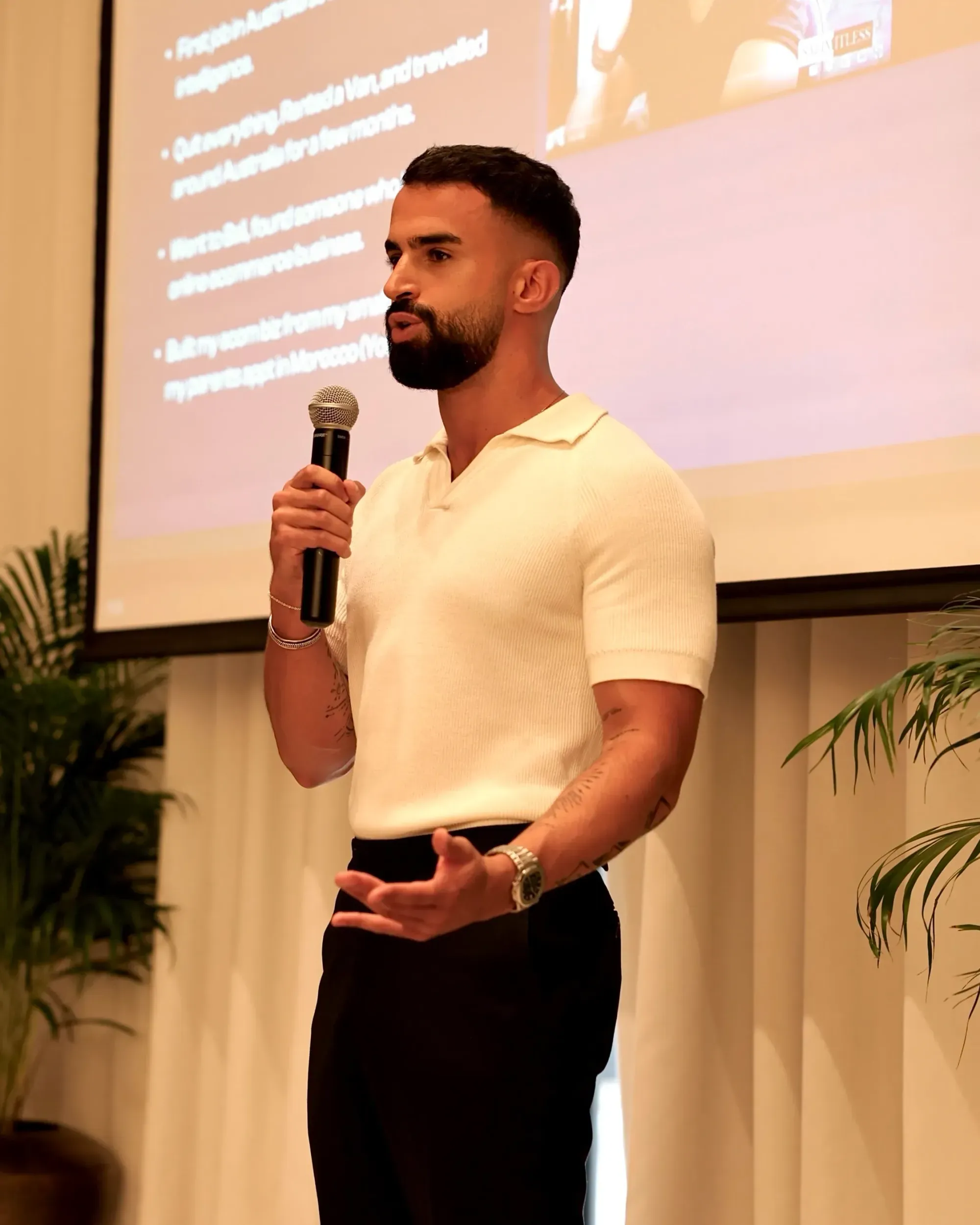 Tan Gera giving a speach at a conference