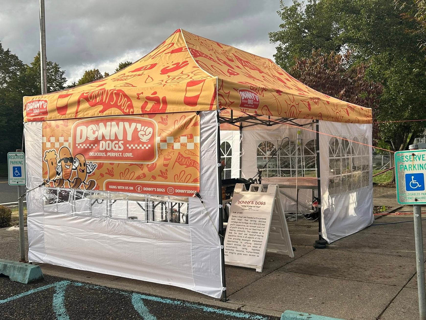 Donny's Dogs branded canopy tent for the street-market vendor setup.