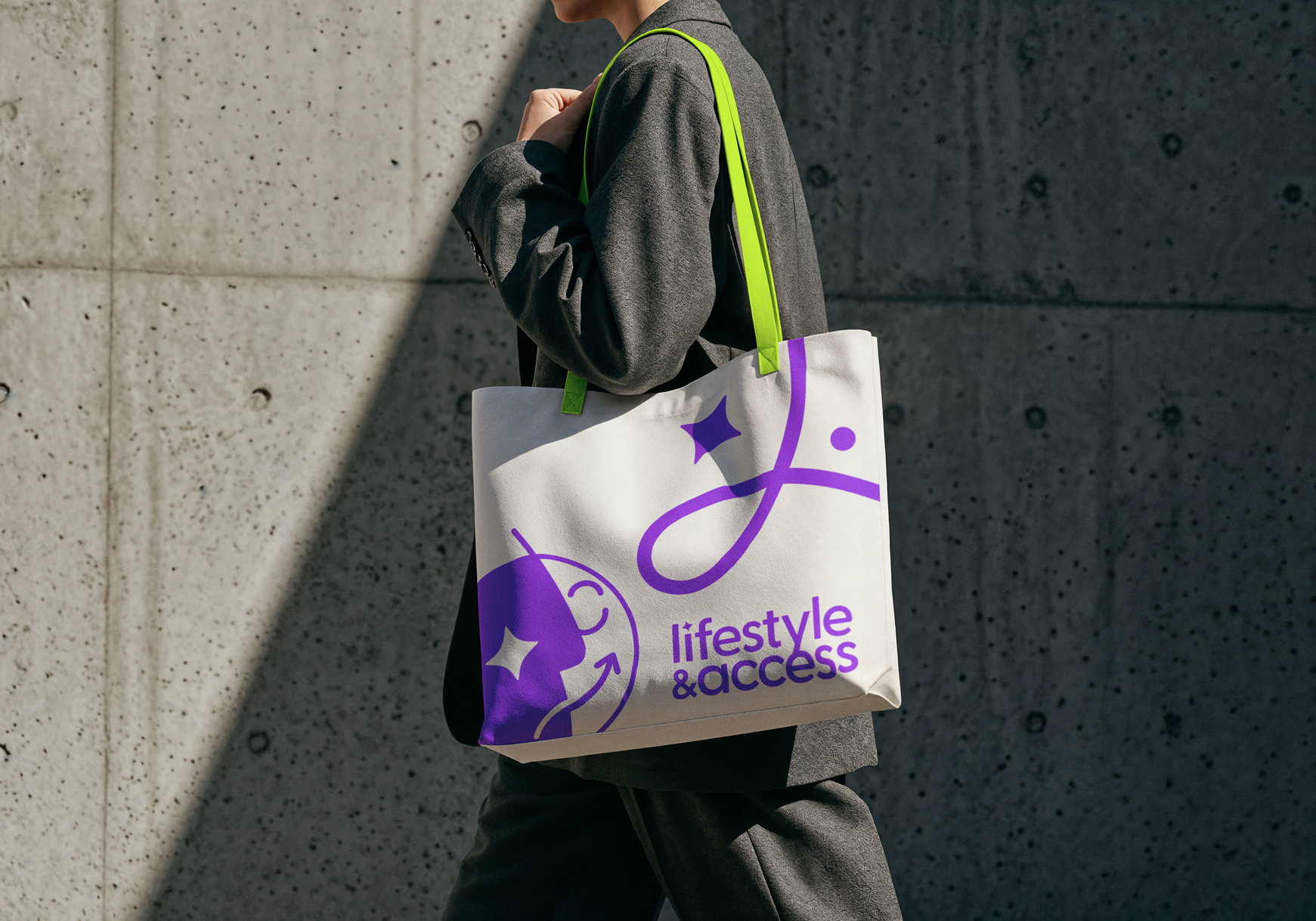 Woman carrying a Lifestyle & Access branded tote bag as a brand mockup.