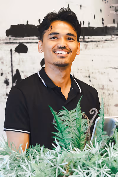 Happy host welcomes you inside Collingwood's best breakfast restaurant, Eggsmart