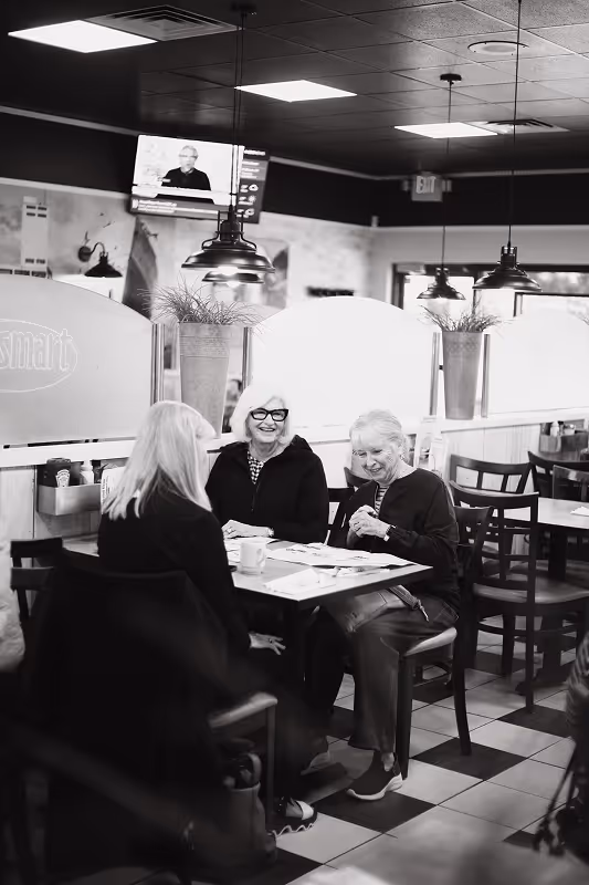 Group of ladies eating brunch at Eggsmart, a proudly Collingwood local breakfast restaurant