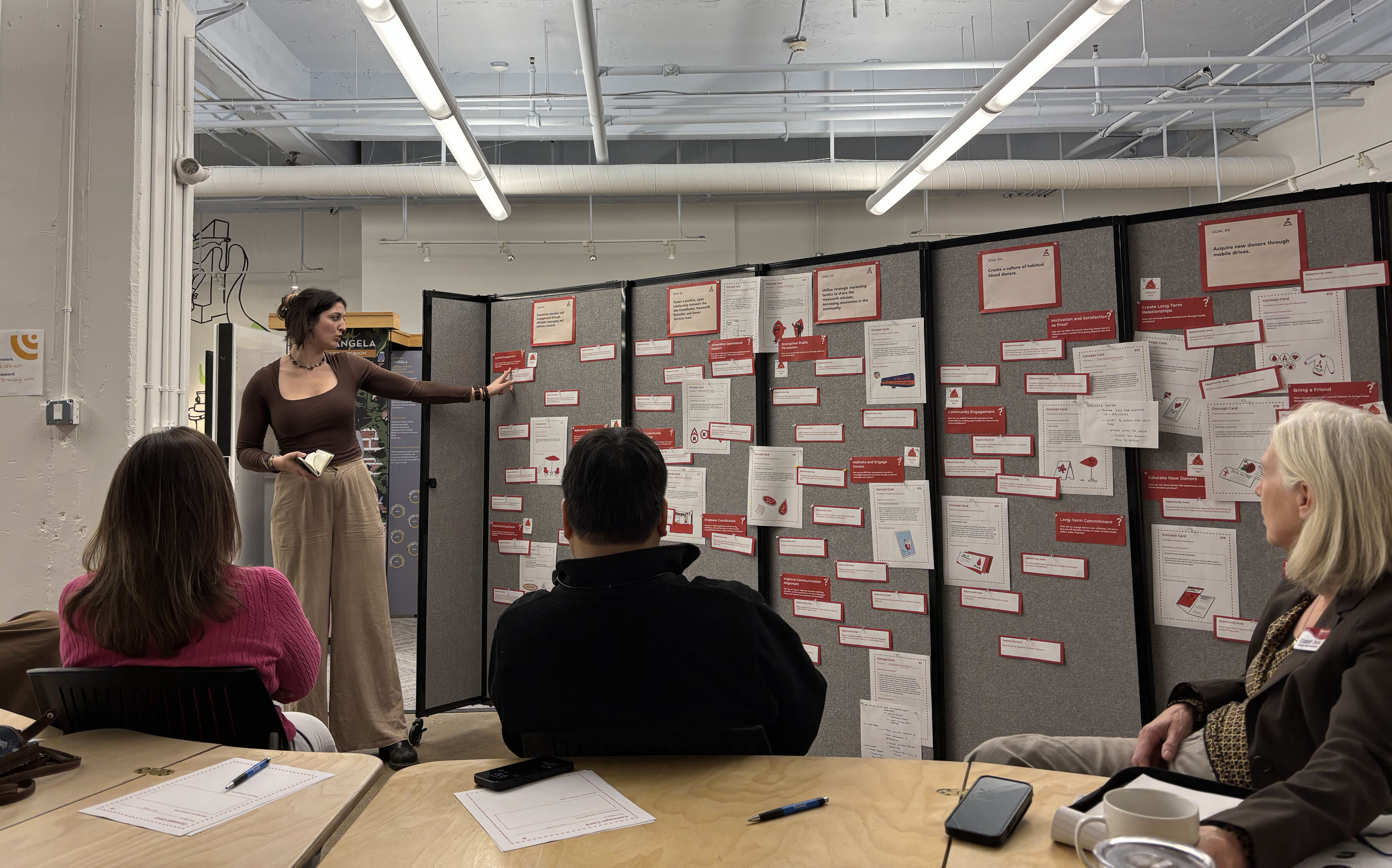 A team member presenting concepts to the Hoxworth clients