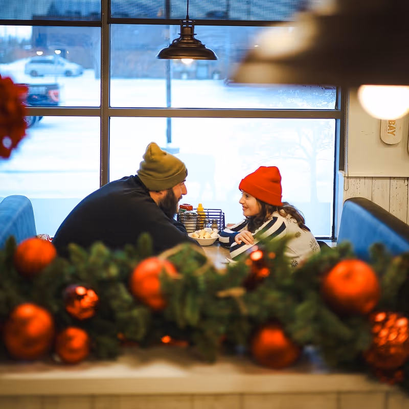 A father and daughter out for breakfast at Eggsmart Collingwood
