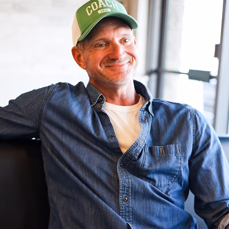 A smiling guest enjoying their meal at Eggsmart Collingwood
