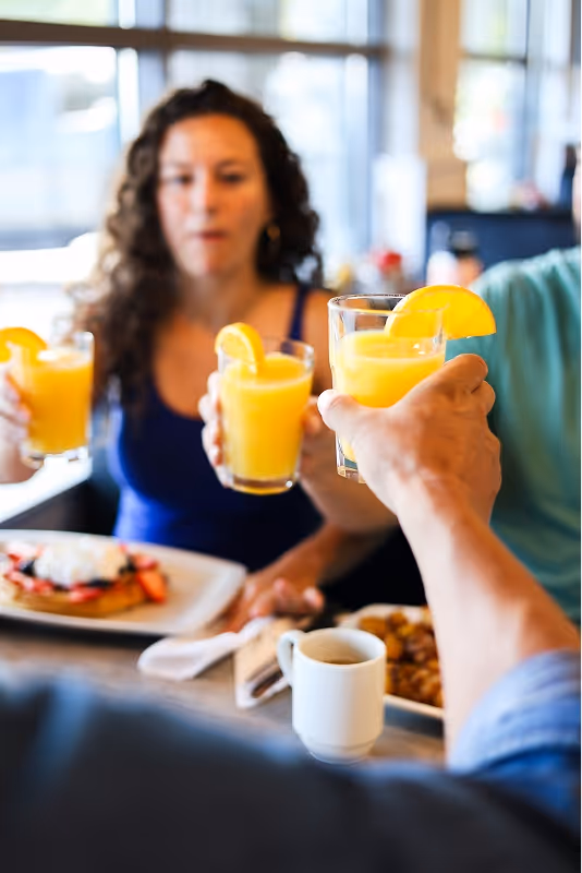 Group Breakfast Mimosas Portrait Eggsmart Collingwood