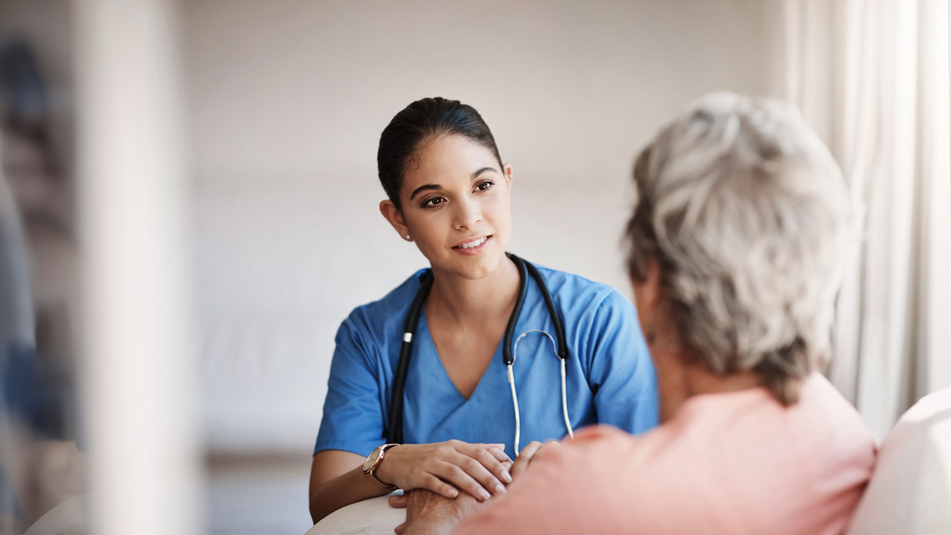 Nurse speaking with senior