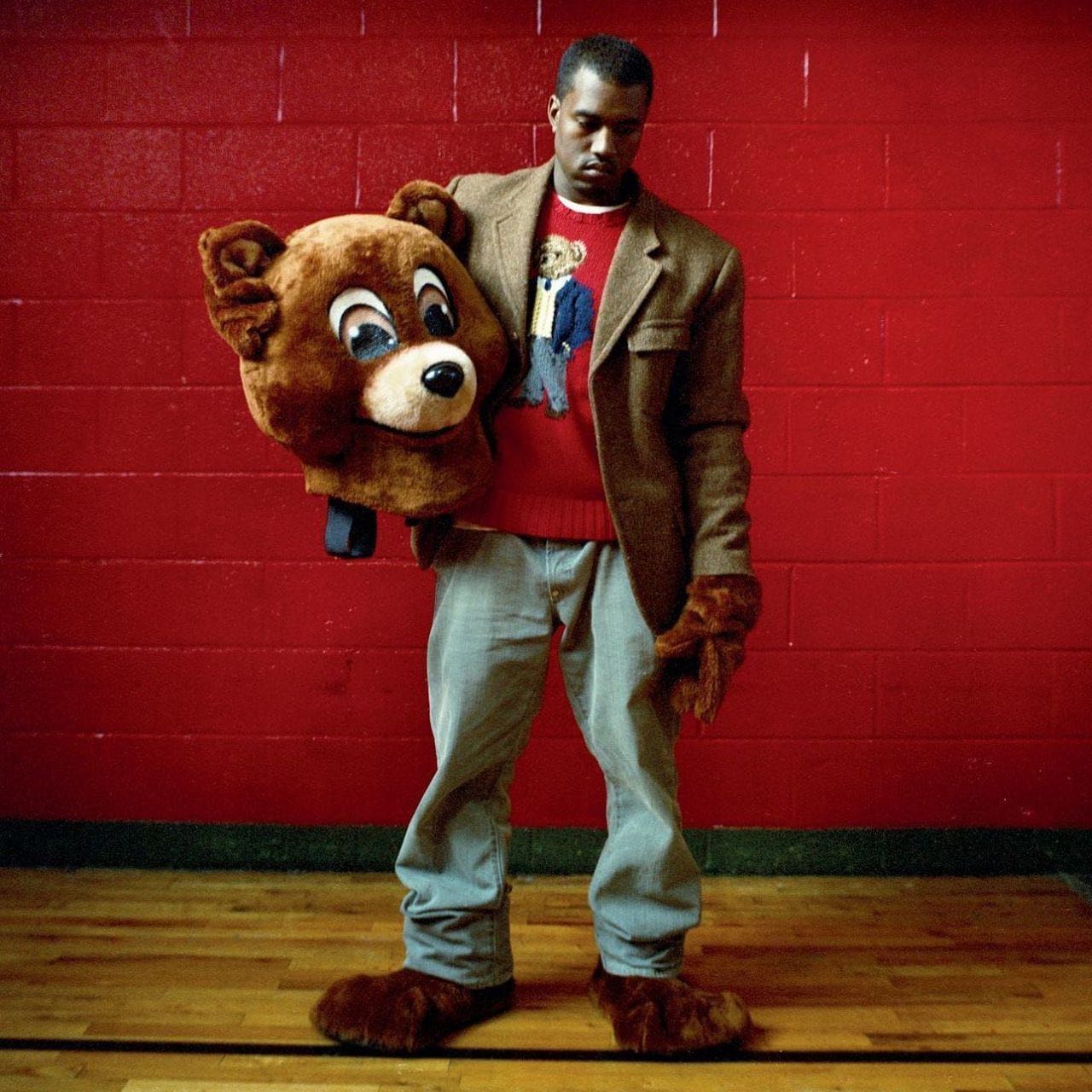 Kanye West holding the College Dropout bear costume's head