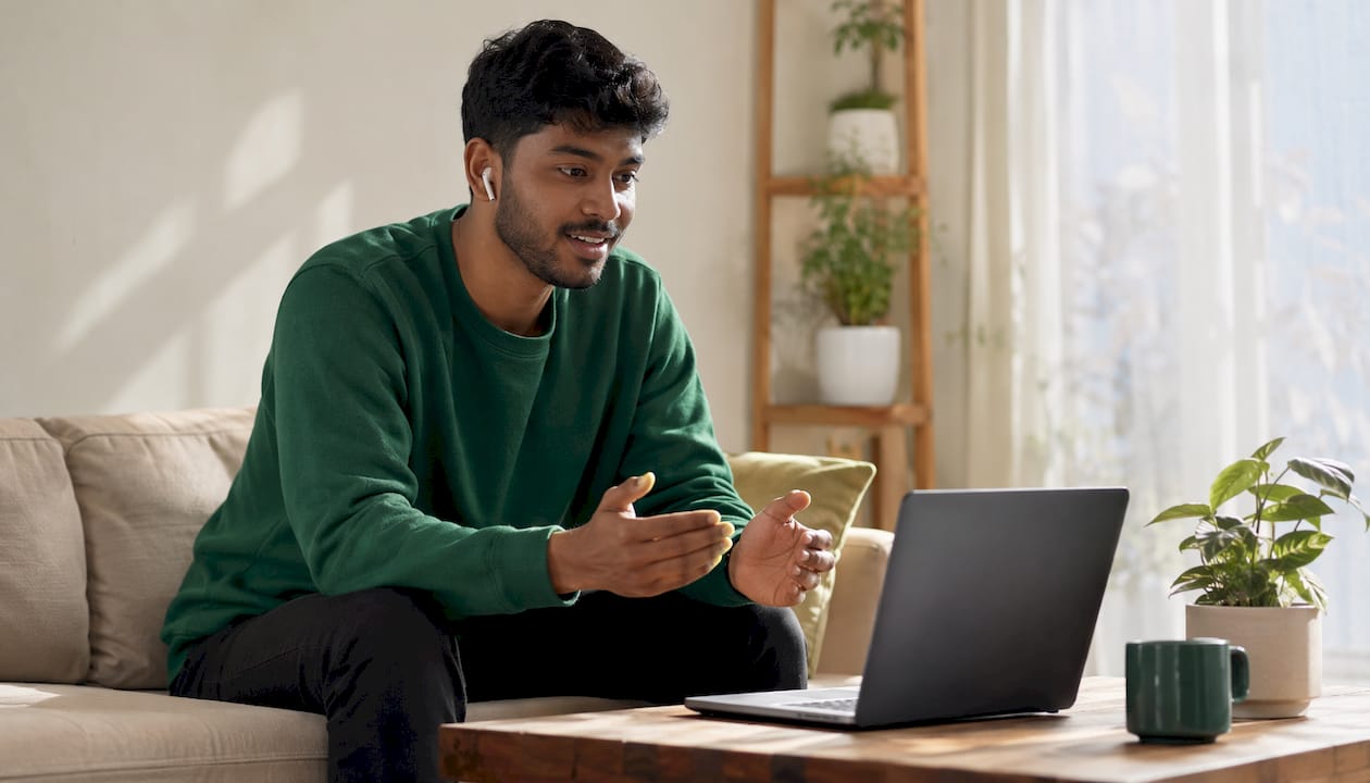 Man in home office on telehealth video call