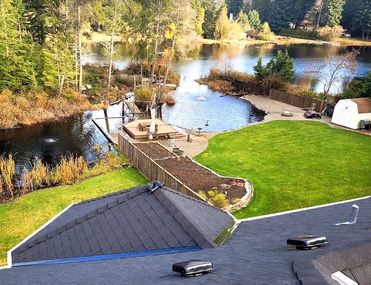 New roof, large backyard with lake. 