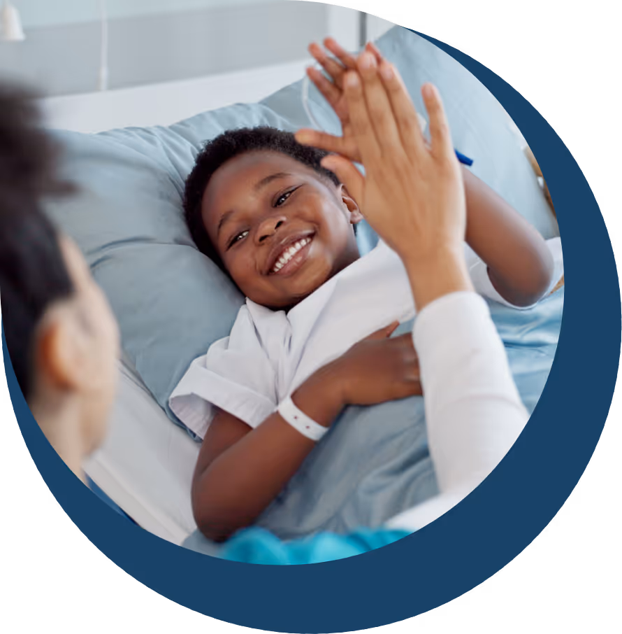 Smiling boy in hospital bed