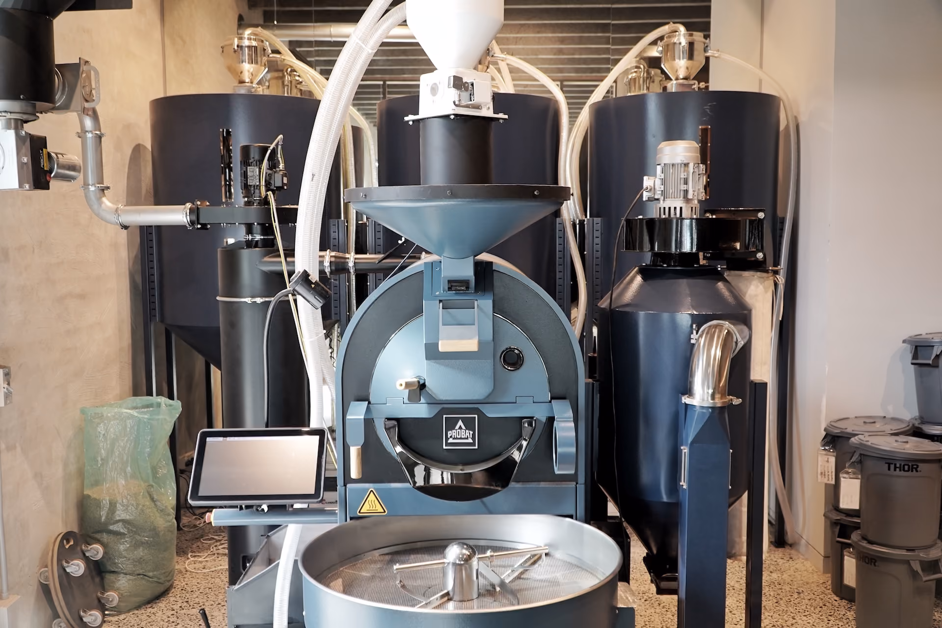 Contraband's roaster and fermentation tanks in the production area