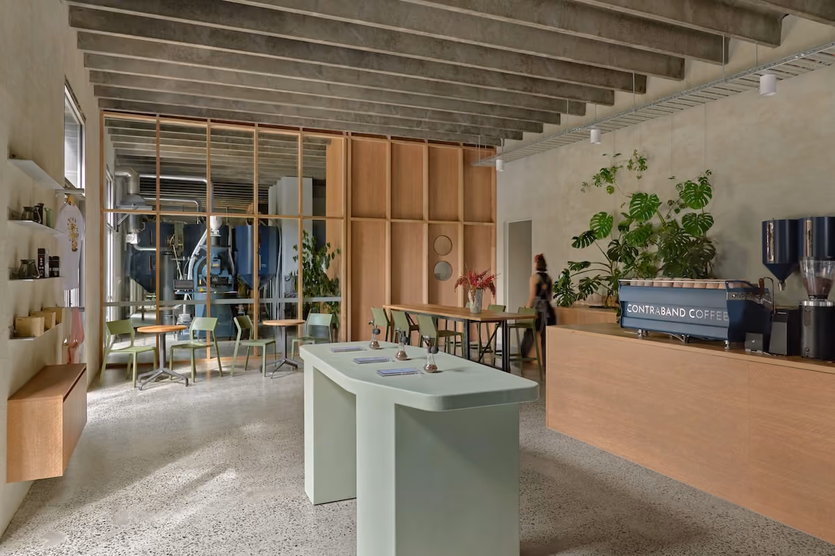 Interior of the Contraband Coffee roastery and cafe with counter and roaster