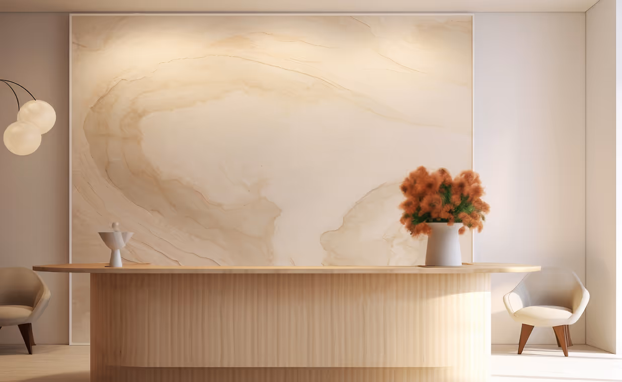 Minimalist room with a wooden table, beige chairs, a white vase with orange flowers, and a large abstract beige and brown wall art.