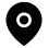 White circle with a smaller filled circle inside on a black background.