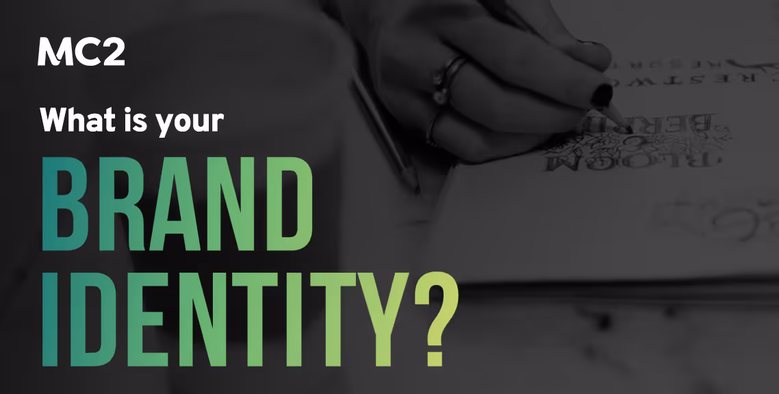 What is your Brand Identity text with hand writing out branding on paper
