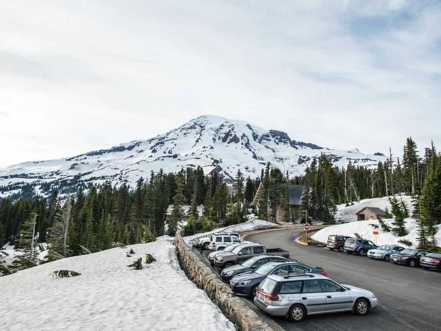 Washington — Scenic view of a snowy mountain landscape with parked cars.