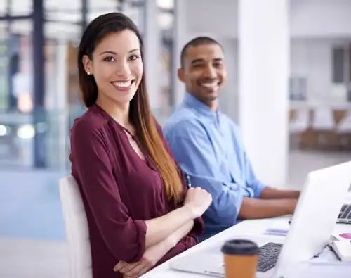 Woman and Man sitting at desk