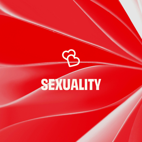 Abstract red background with two white hearts intertwined in the center and the word “SEXUALITY” in white.