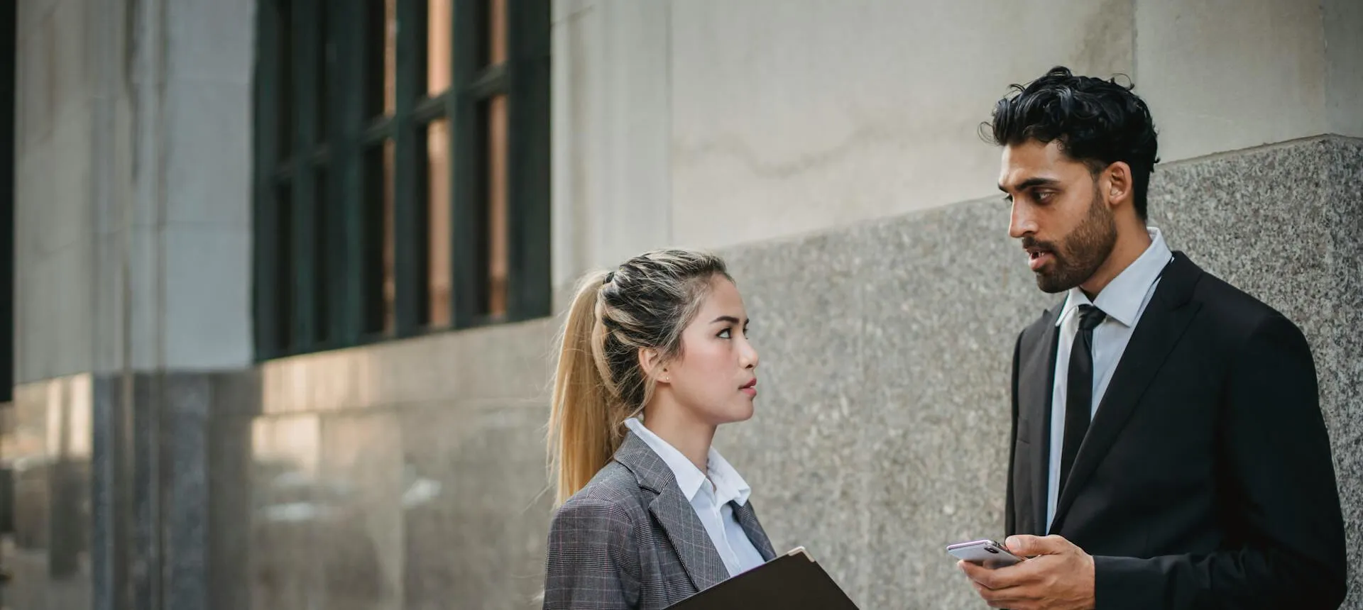 businessman and businesswoman talking
