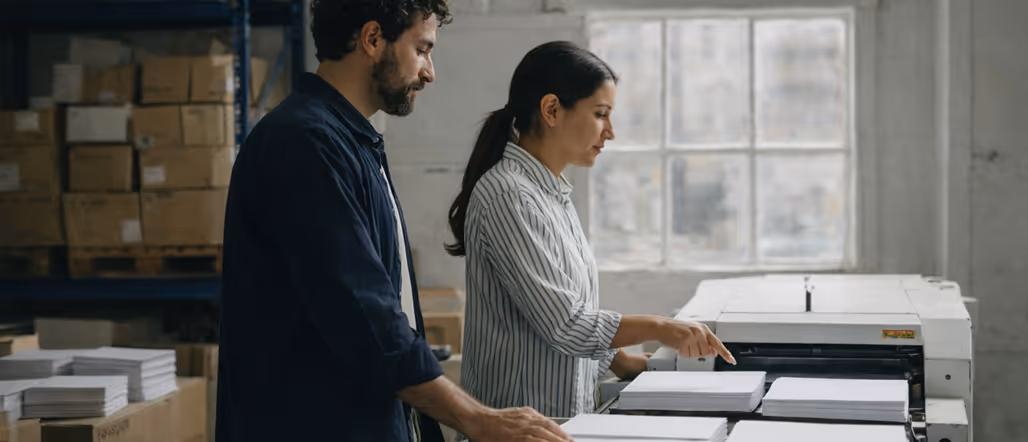 man and woman in a paper factory