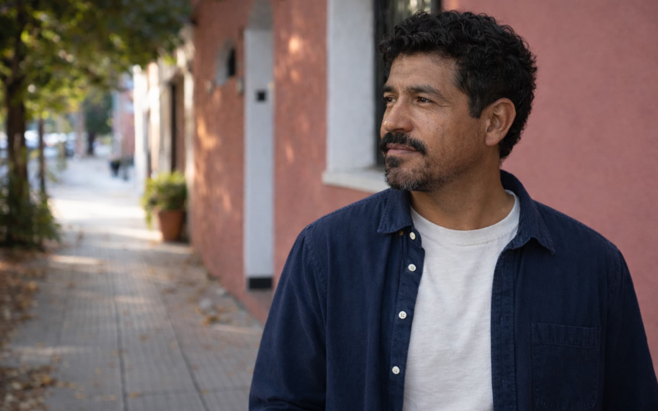 mexican man with a beard on the street