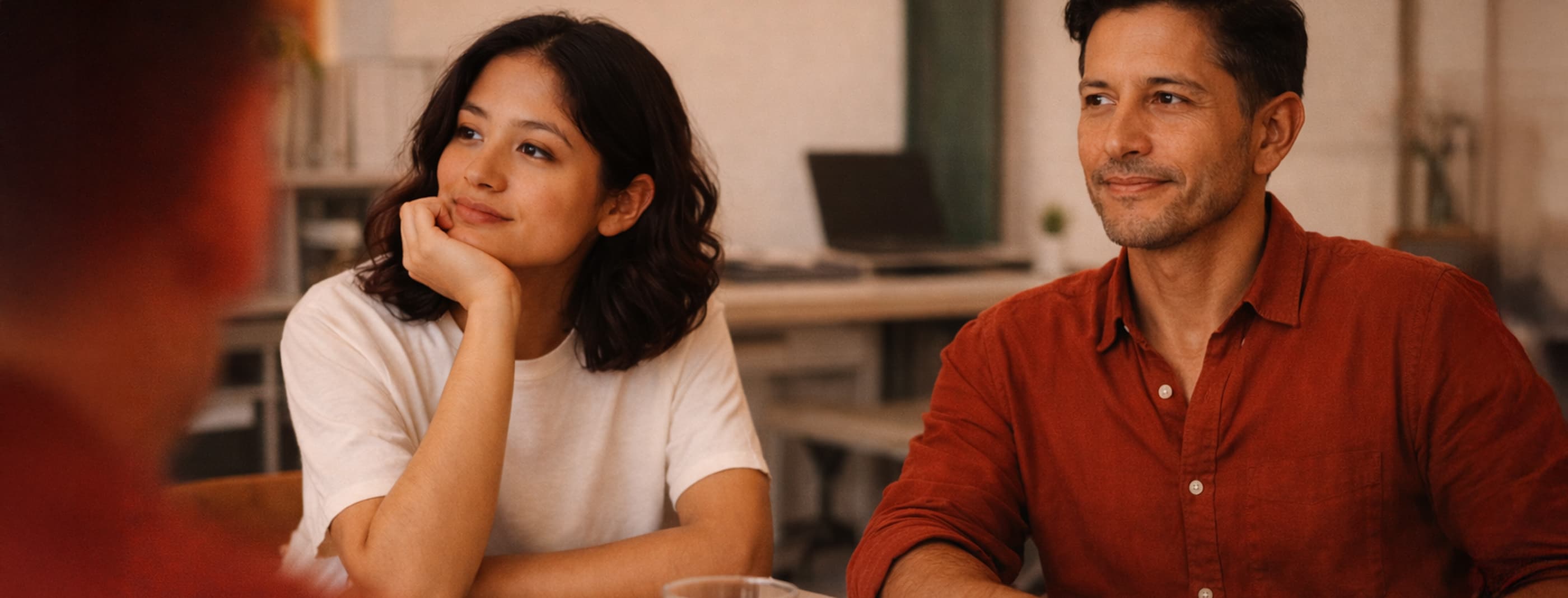 man and woman smiling in the office
