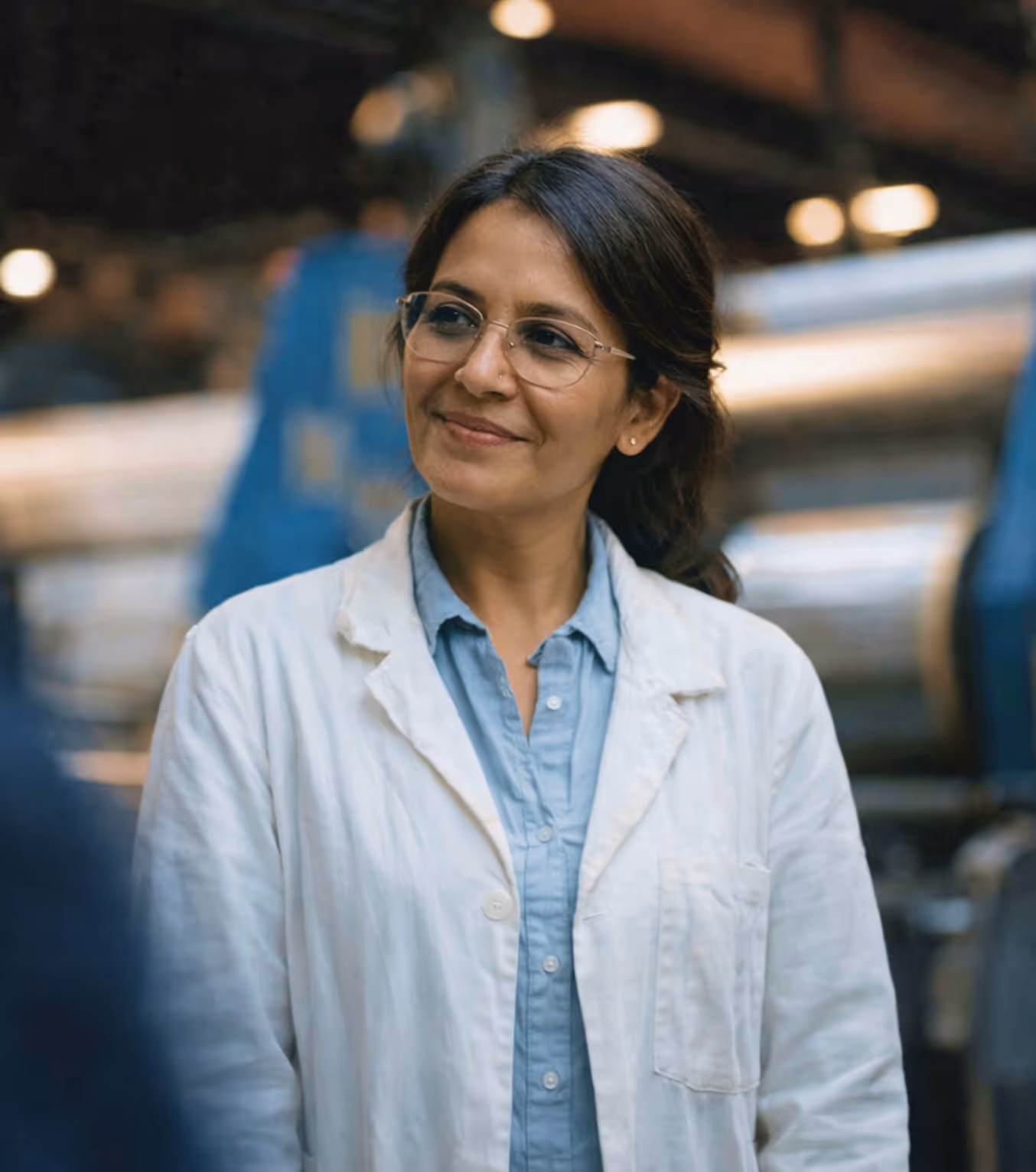 woman smiling in a lab coat