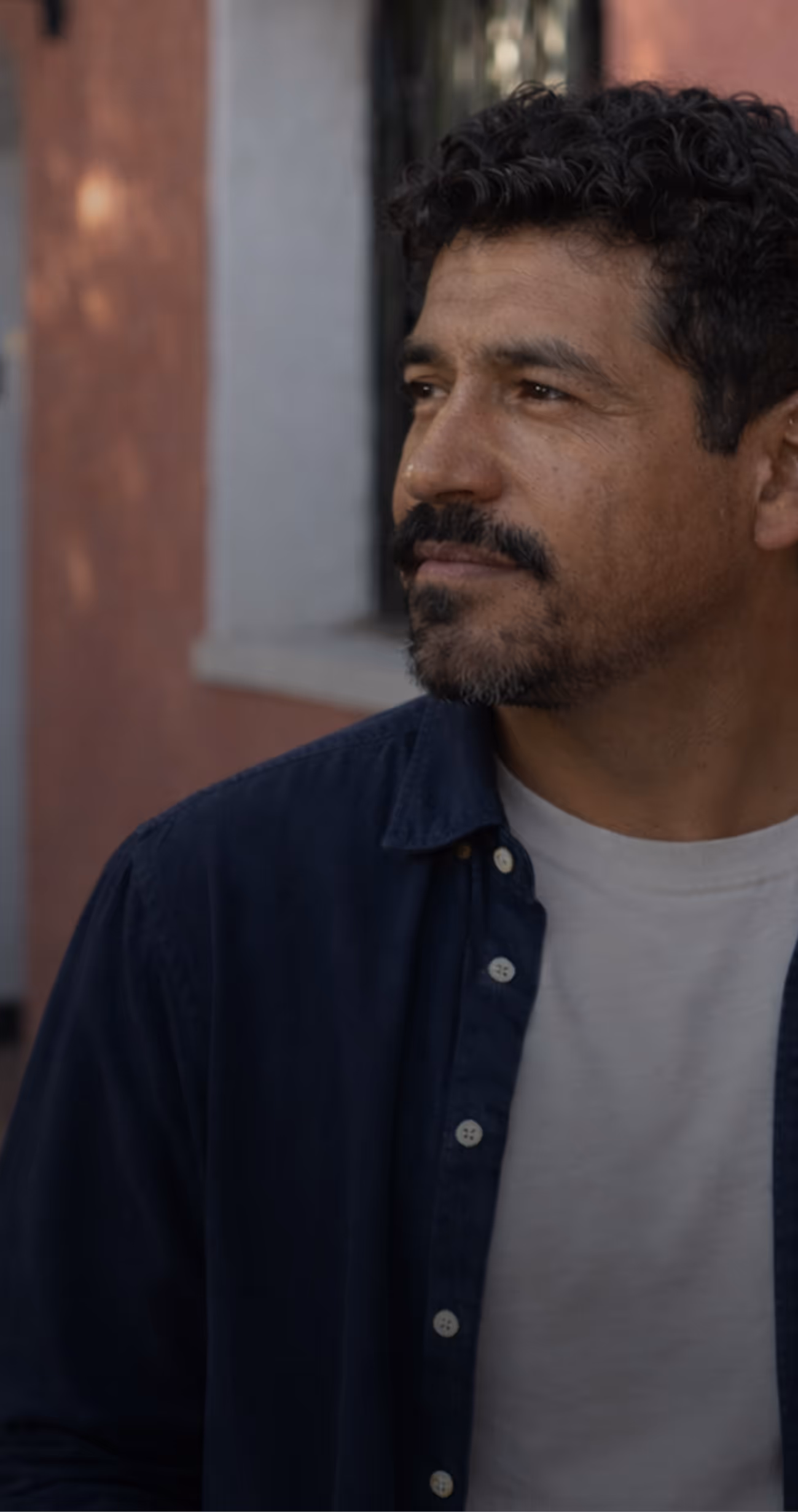 mexican man with a beard on the street