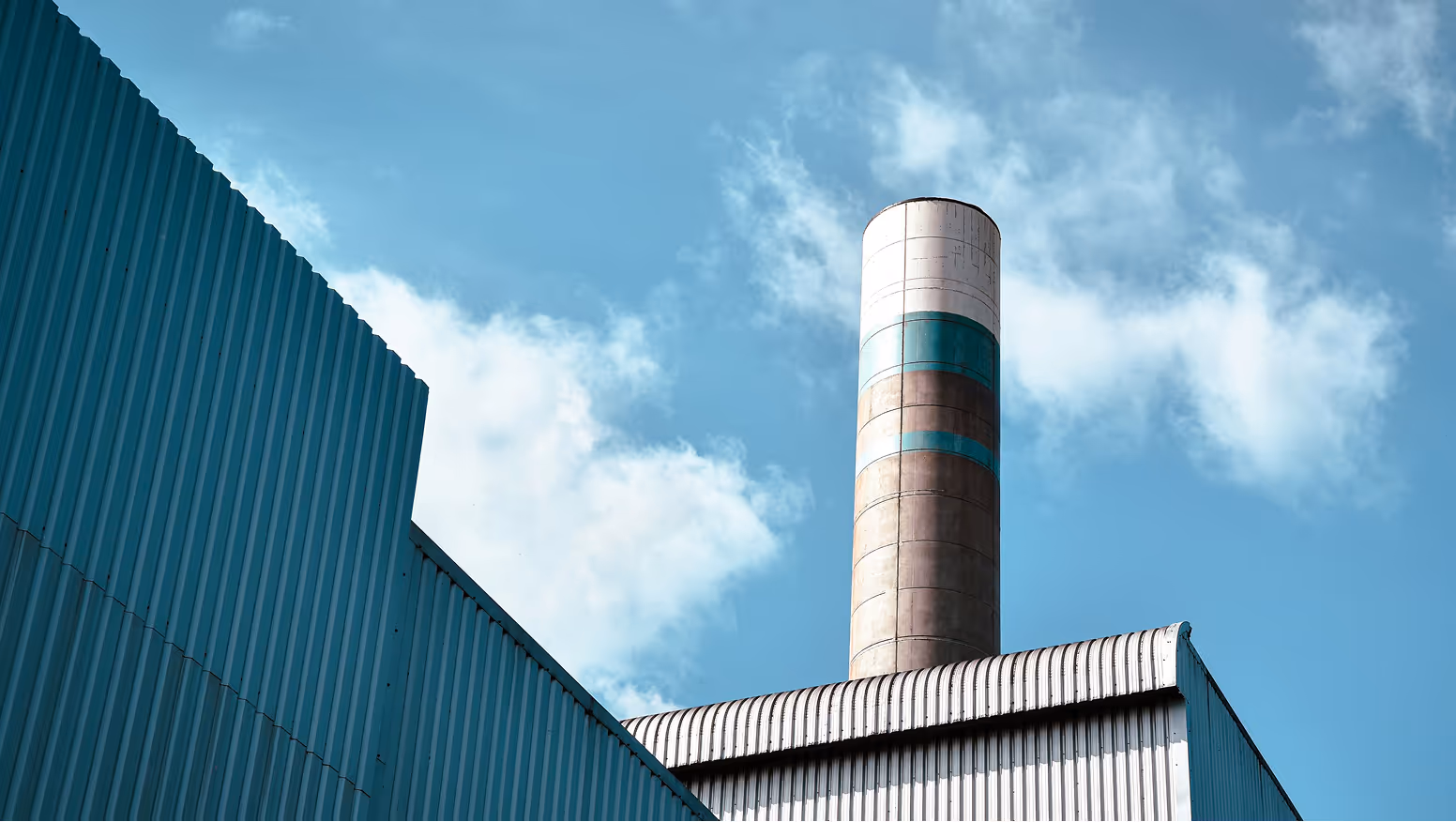 factory chimney in white and blue sheets
