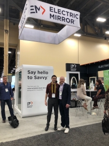 Two men posing at Electric Mirror booth