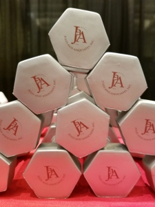 Pyramid of hexagonal dumbbells on a red table