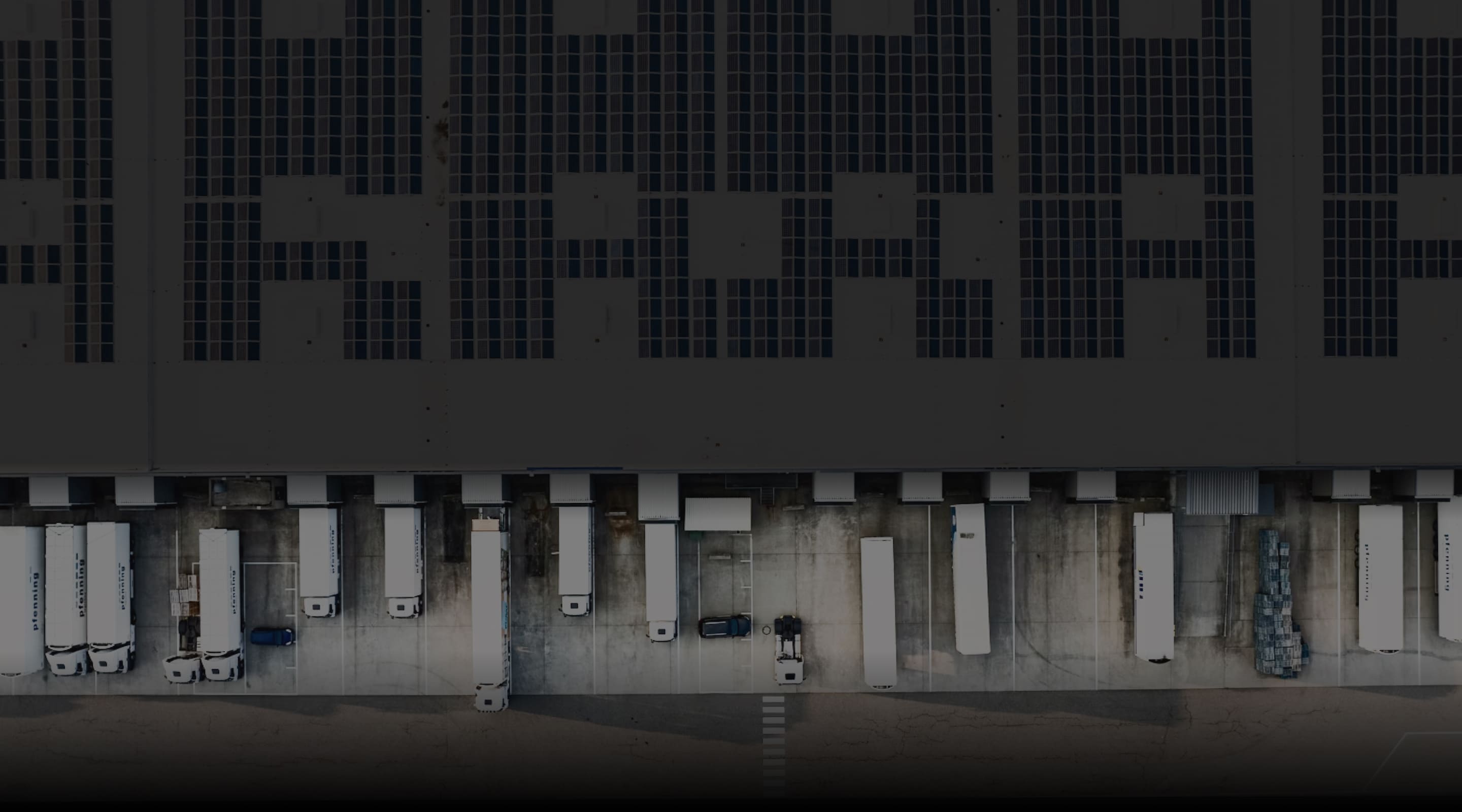 Trucks lined up at warehouse loading docks
