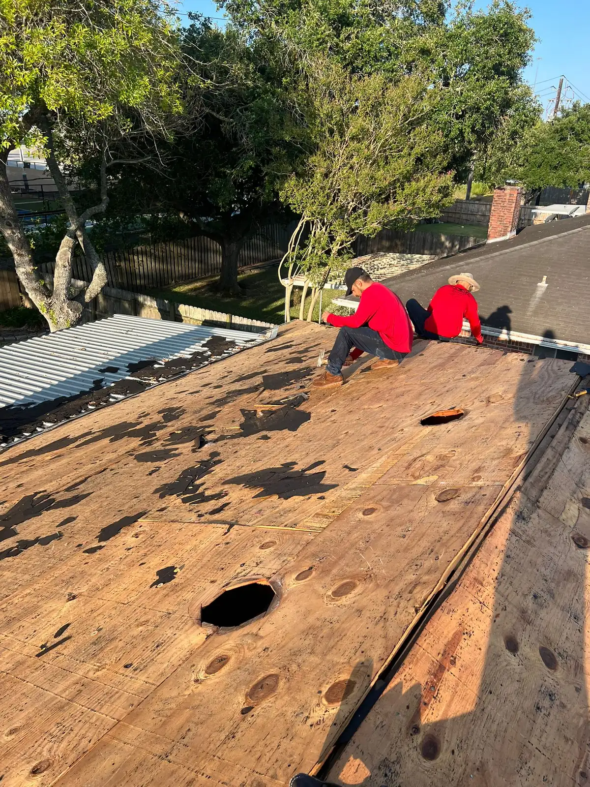 Roof decking exposed during roof replacement project in Houston TX