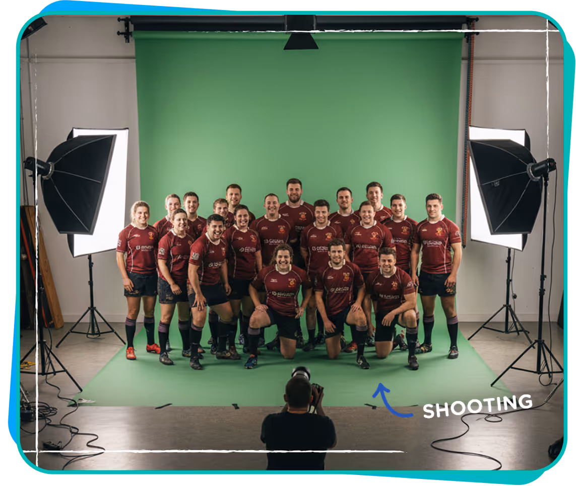 Rugby team wearing maroon jerseys posing for a studio photoshoot with green backdrop and professional lighting.