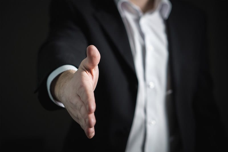 man in suit handshake