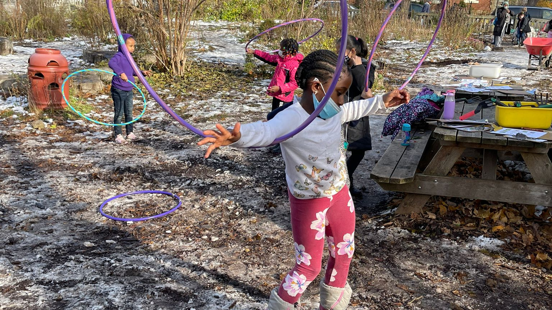 Child playing with hula hoop in the Winchester garden
