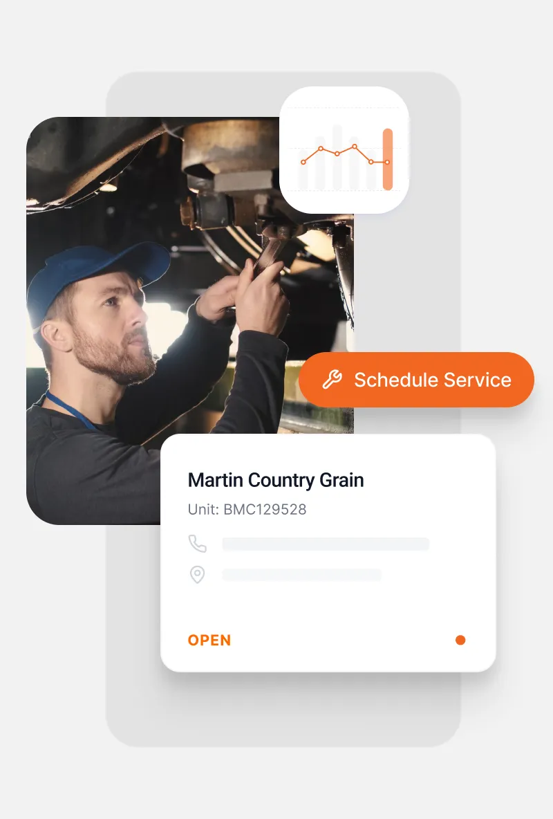 Man in blue cap using wrench to fix machinery with overlay cards showing schedule service button and Martin Country Grain unit details.