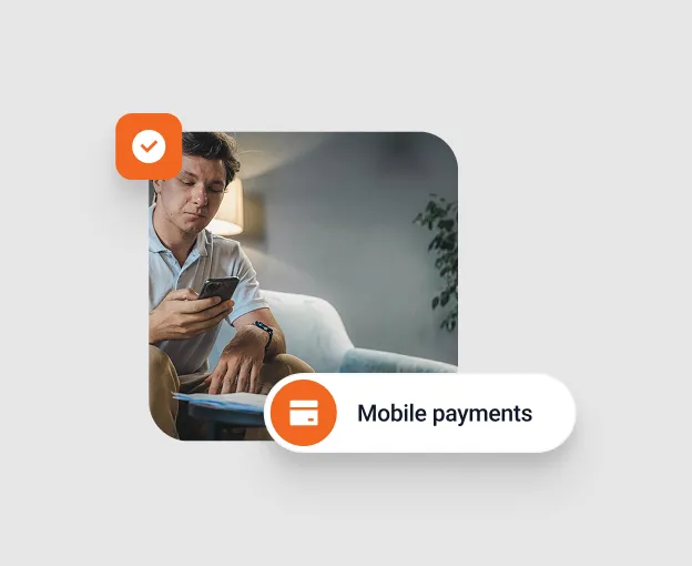 Man sitting on a couch using a smartphone with a label reading Mobile payments.