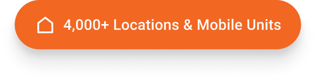 Orange rounded badge with a white house icon and text saying 4,000+ Locations & Mobile Units.