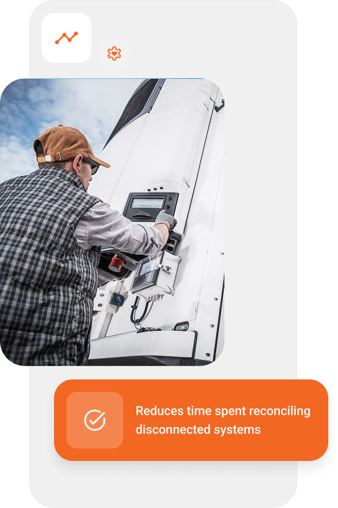 Worker with cap and plaid shirt interacting with a control panel on a large white truck.