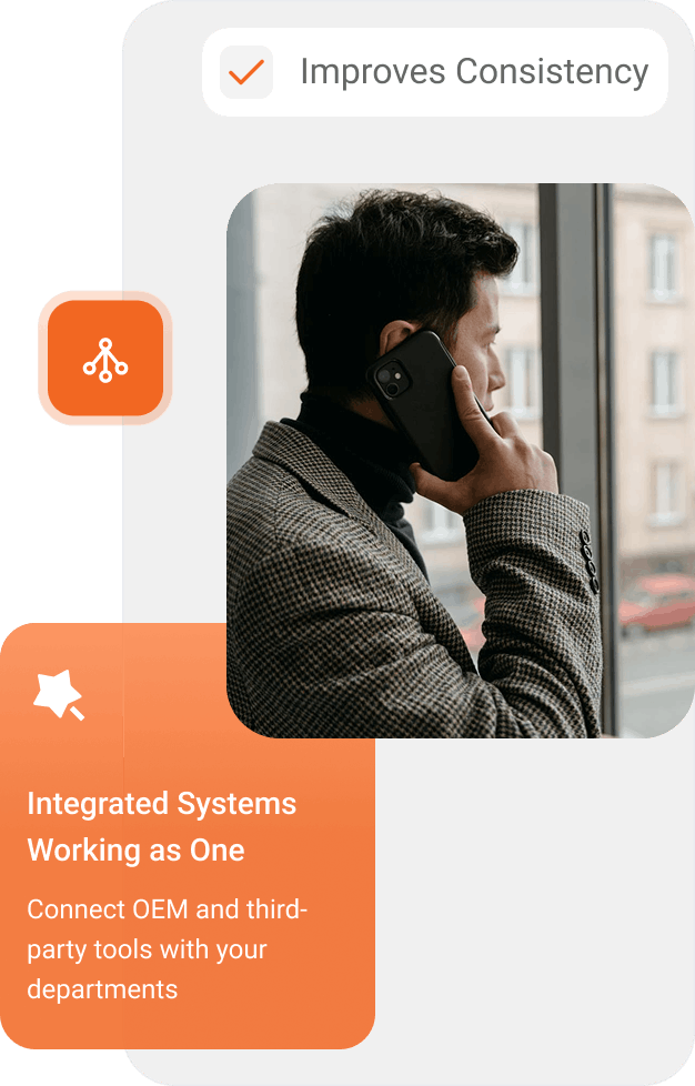 Man in a checkered jacket speaking on a smartphone by a window with urban buildings outside, accompanied by text about integrated systems improving consistency and connecting OEM and third-party tools with departments.