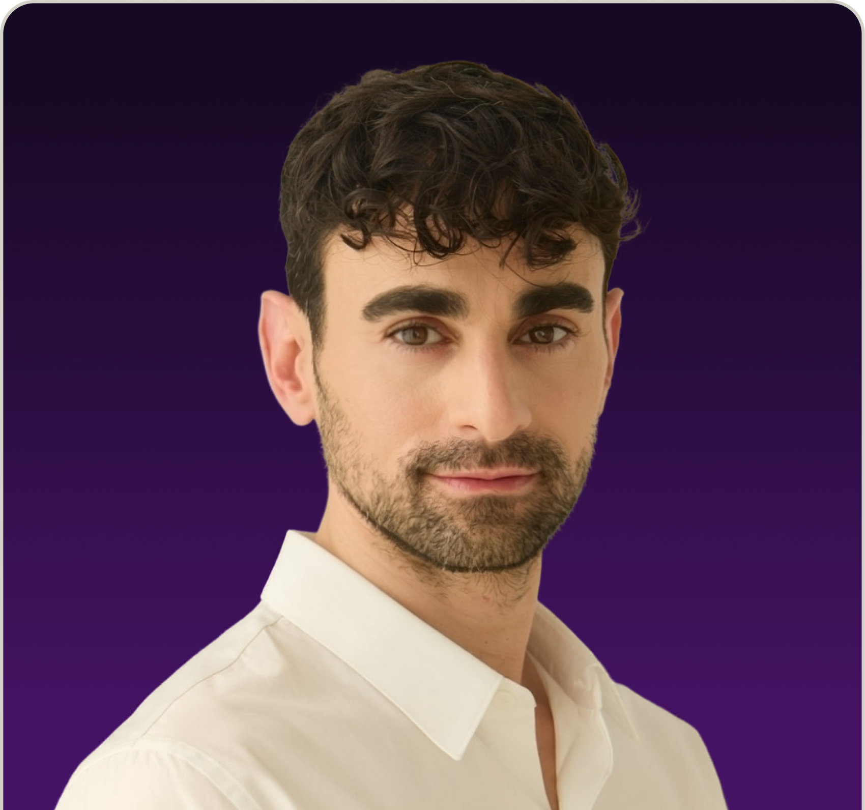 Portrait of a man with curly dark hair, brown eyes, and a trimmed beard wearing a white collared shirt against a dark purple background.
