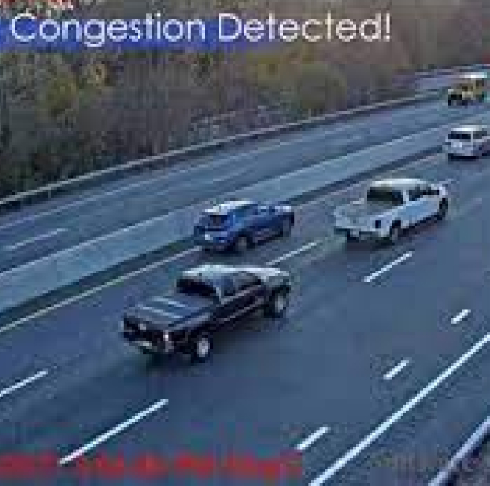 Multiple cars slowing down on the freeway.